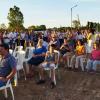 Familias sentadas, en la ceremonia de inauguración de Covitrasis